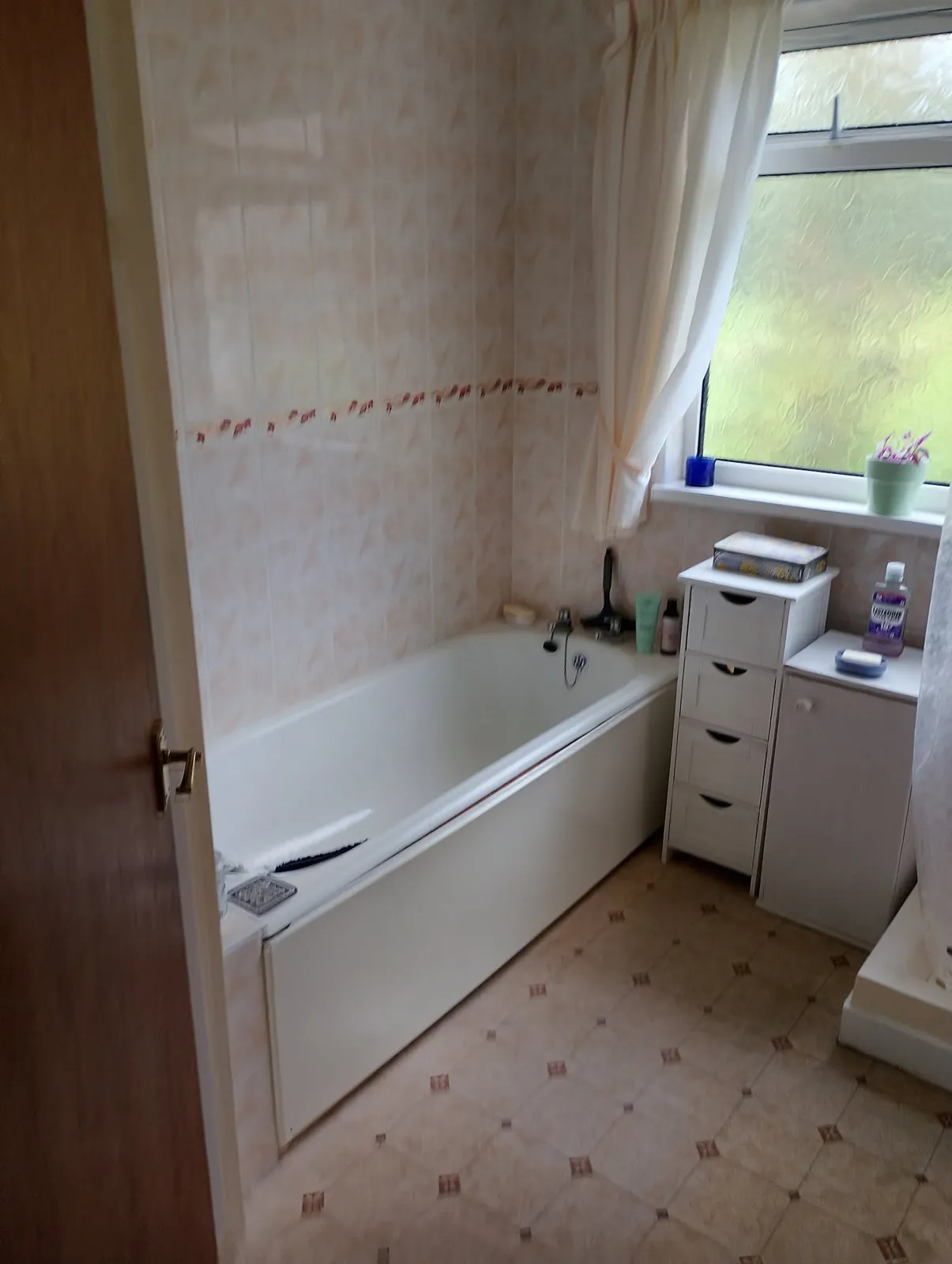 Before: Dated bathroom out, new shower room in