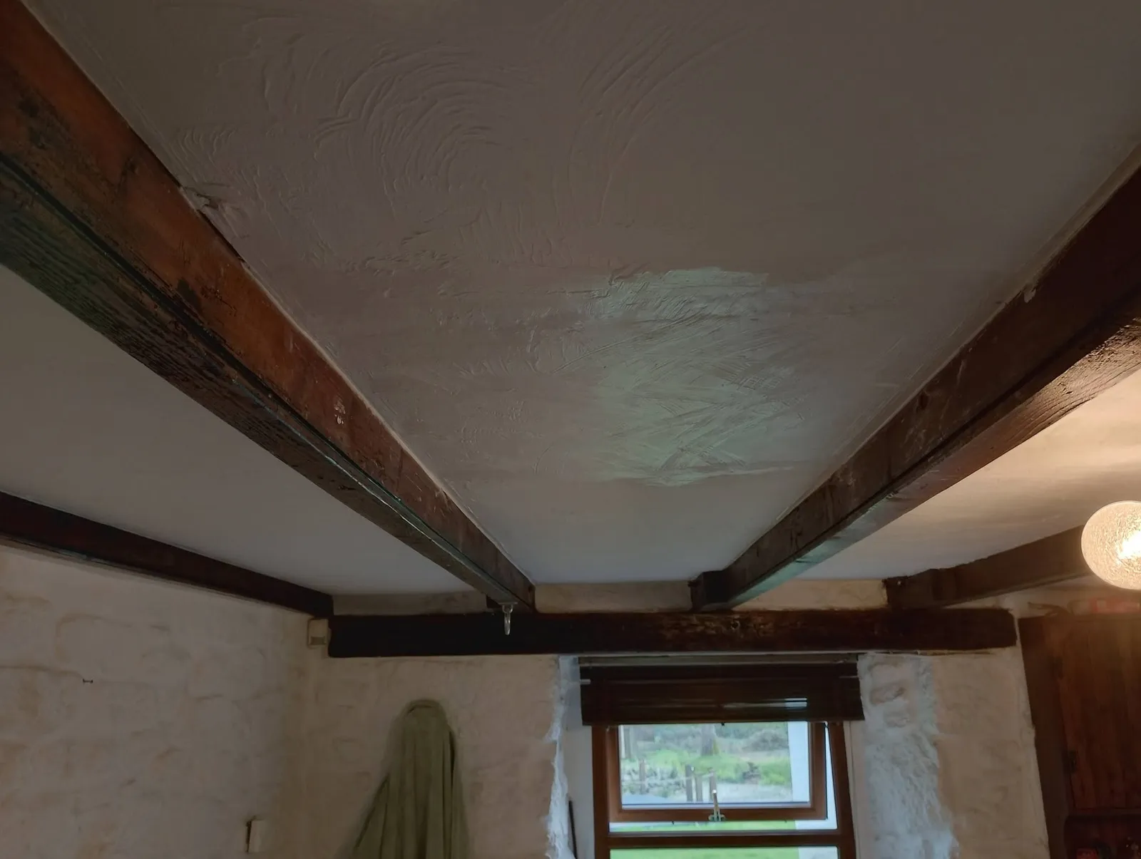 Ceiling plastered between the beams